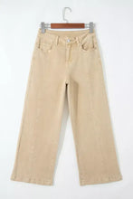 Beige wide-leg denim jeans with a solid color seamed center and classic front pockets in a straight-cut silhouette