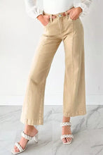Beige high-waisted wide-leg denim trousers with solid color seamed center and visible stitching details