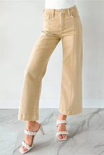 Beige solid color seamed center wide leg cropped jeans with high waist and rolled cuffs made of denim material