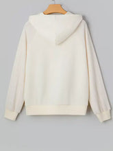 Cream-colored solid color textured sleeve patchwork half zip hoodie with sheer textured sleeves and slightly stretchy material