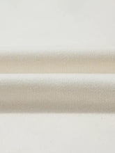 Two pieces of off-white ribbed knit fabric showing slightly stretchy material for solid color textured half zip hoodie