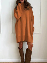 Cozy oversized orange knit turtleneck sweater dress with ribbed cuffs