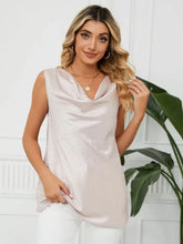 A shimmering blush pink sleeveless cowl neck top with a subtle leopard print pattern