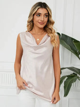 A shimmering blush pink sleeveless solid cowl neck top with a subtle textured pattern