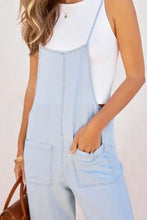 Light blue spaghetti strap denim overalls with pockets