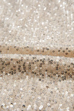 Sparkling sequin long sleeve bodysuit in beige with silver and black circular sequins on shimmering fabric
