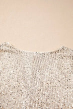 A shimmering silver sequin long sleeve bodysuit with a delicate fitted neckline for elegant wear