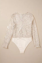 A shimmering silver sequin long sleeve bodysuit with a contrasting white lower section for stylish wear