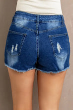 Spliced lace distressed denim shorts with frayed hems