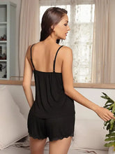 Black lace-trimmed spliced mesh cami and shorts pajama set with thin spaghetti straps and adjustable strap length