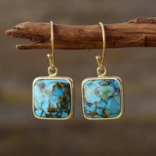 Gold-toned square copper drop earrings with turquoise stones