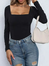 Black square neck long sleeve bodysuit made of soft fabric with a sleek square neck design for versatile wear