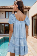 Light blue denim dress with square neck puff sleeves and tiered ruffle skirt machine wash cold recommended