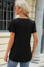 Womans black square neck short sleeve T-shirt with puffed shoulders