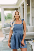 Blue denim dress with square neck tie and neck tie shoulder featuring a flared mini skirt