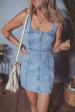 Light blue denim dress with square neck wide strap and front zipper in a mini length style