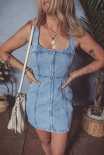 Light blue denim dress with square neck wide strap and front zipper in a mini length style