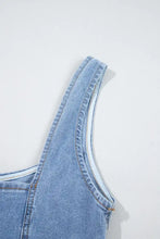 Light blue denim dress with square neck wide strap featuring visible stitching and contrasting white inner lining