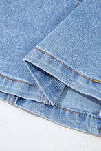 Light-wash denim dress with square neck wide straps featuring visible stitching and faded texture details
