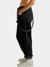 Square neck wide strap denim overalls in black with rolled cuffs