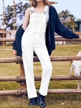 Square neck wide strap denim overalls in white with blue cardigan and boots