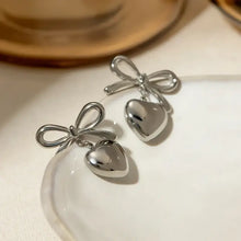 Silver-toned stainless steel bow heart drop earrings
