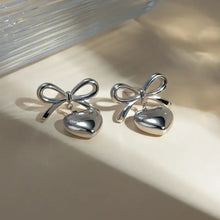Silver-toned stainless steel bow heart drop earrings