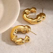 Polished gold-toned stainless steel C-hoop earrings, irregular hoops
