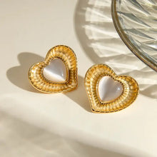 Cat’s eye stone heart earrings with gold and mother-of-pearl centers