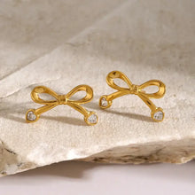 Gold Zircon Bow Earrings with Heart-Shaped Clear Gems
