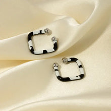 Stainless steel oil drip cuff earrings with black white zebra stripes