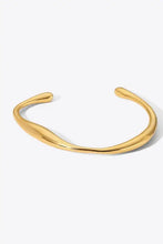 Stainless steel open bracelet with gold twisted bangle design