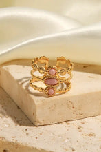 Gold-toned stainless steel open ring with pink oval and round gemstones