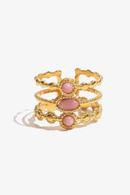 Gold-toned stainless steel open ring with three pink oval and round gemstones