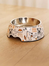 Stainless steel pet bowl with white ceramic exterior and playful dog design