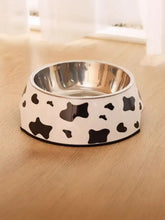 White cow-print stainless steel pet bowl with steel bowl interior