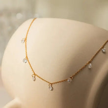 Stainless steel rhinestone pendant necklace with gold chain and clear teardrop charms