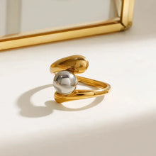 Gold and silver stainless steel twisted ring with polished finish