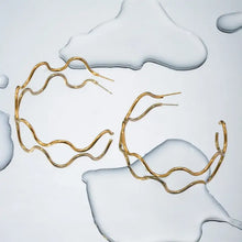 Gold stainless steel wave shape C-hoop earrings with wavy hoops