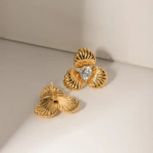 Gold steel zircon flower shape earrings with diamond center