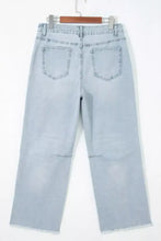 Light-wash denim cropped jeans with star embellishments straight-leg cut and frayed hems