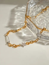 Two-tone gold and silver star heart necklace with safety pin charm