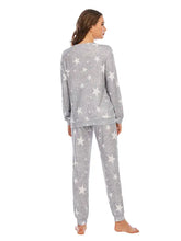 Gray star-patterned star top and pants lounge set in soft textured fabric for comfortable casual wear