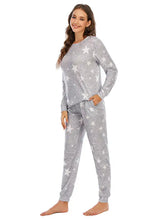 Gray star-patterned star top and pants lounge set made of soft textured fabric for comfortable wear