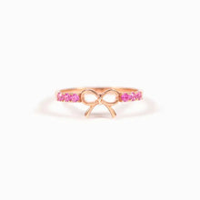 Sterling silver bow ring with rose gold accents and pink gemstones