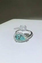 Elegant sterling silver bypass ring with pear teal moissanite accents