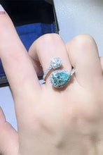 Sterling silver bypass ring with pear teal diamond accents