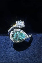 Sterling silver bypass ring with pear teal moissanite and diamond accents