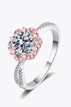 Sterling silver crisscross ring with pink halo and brilliant-cut diamond