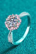 Sterling silver crisscross ring with pink halo and brilliant-cut diamond